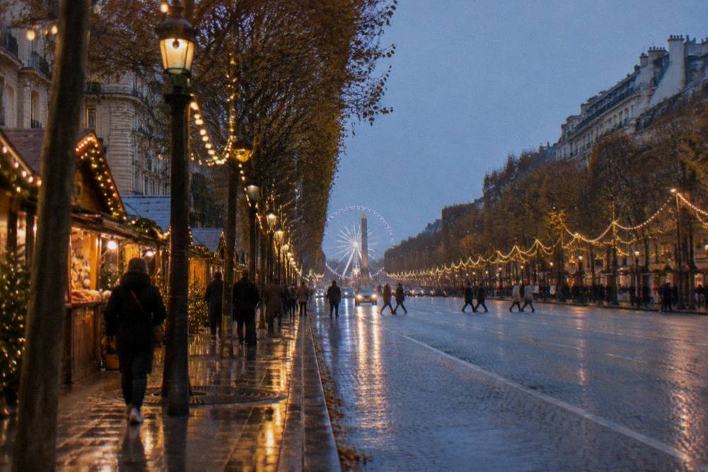 An illuminated Paris avenue with garlands and a glowing ferris wheel in the distance